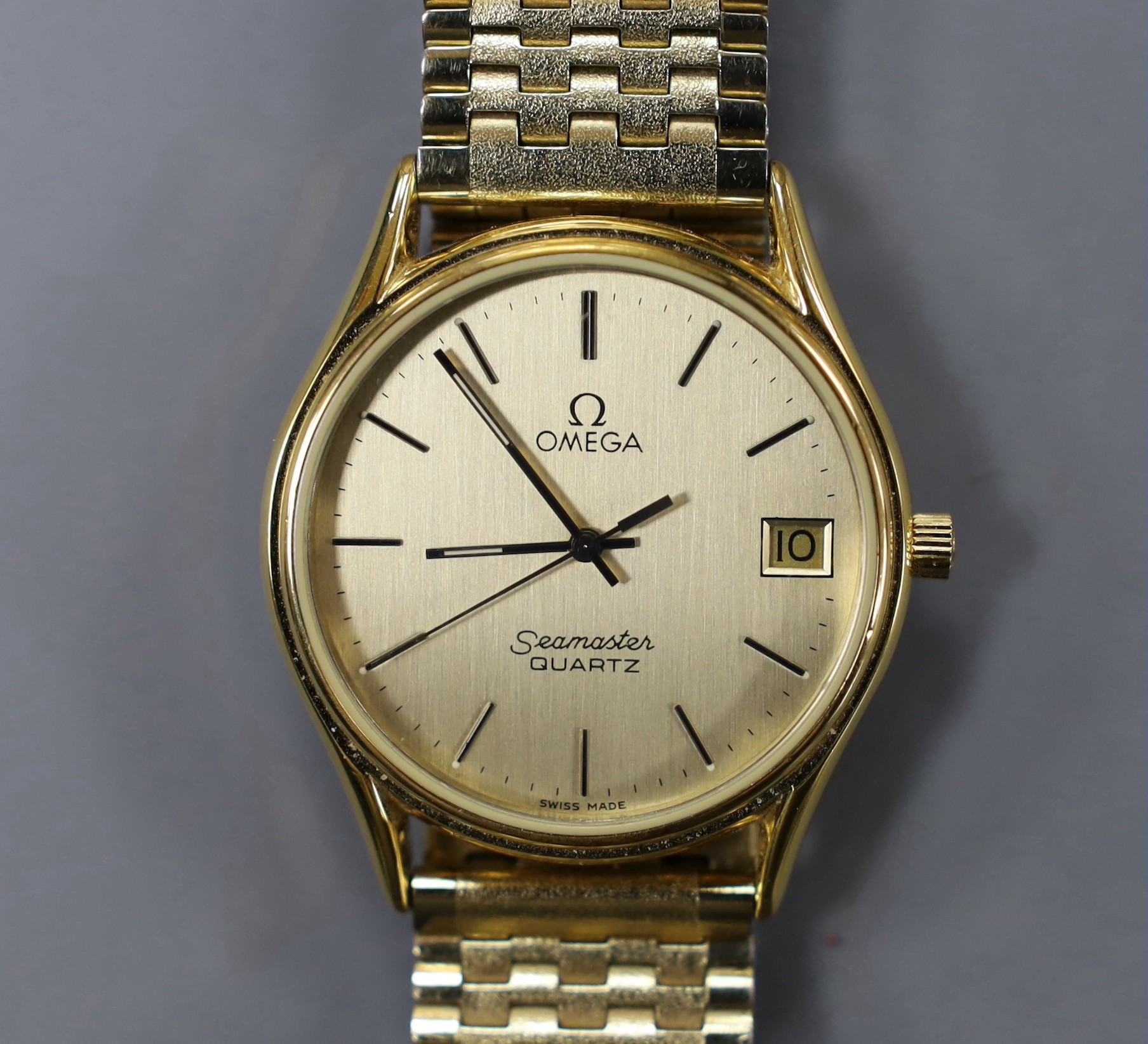 A gentleman's steel and gold plated Omega Seamaster quartz wrist watch, with spare links and Omega box.